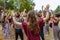 Diverse people dance at earth festival