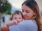 Diverse people portrait of mother with swarthy infant.