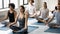 Diverse people practicing yoga, sitting in Easy Seat pose