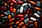 Diverse pills arrayed on red, allowing text Patterns and pill identification featured