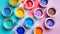 Diverse selection of open paint cans displayed on vivid and dynamic multicolored background