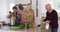 Diverse senior couples preparing vegetable salad in a kitchen