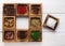 Diverse spices in a wooden box closeup