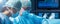 Diverse team of professional medical surgeons perform surgery in the operating room using high-tech equipment. Doctors