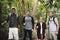 Diverse tourists trekking in a forest