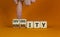 Diversity and humanity symbol. Businessman turns wooden cubes and changes the word `humanity` to `diversity`. Beautiful orange