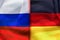 A divided flag of Russia and Germany as a symbol of the current conflict