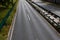 Divided urban highway, overhead view with concrete and guardrail median