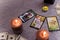 Divination cards alignment with money and green candles. Mystery, astrology, fortune telling, belief and wealth