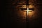 Divine Illumination Lighted Cross Background with Copy Space on Brick Wall. created with Generative AI