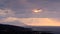 Divine light, stormy sky and sunrise on a landscape around holy mountain Athos