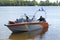 Diving boat floating on the Dnieper river with police lifeguards on duty and equipment aboard