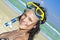 Diving girl in a swimming mask and snorkel