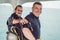 Diving instructor helps a beginner diver prepare for diving