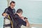 Diving instructor helps a beginner diver prepare for diving