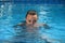 Diving woman in swimming pool