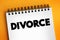 Divorce - canceling or reorganizing of the legal duties and responsibilities of marriage, text concept on notepad