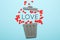 Divorce of couple,  red hearts in trash can. Love and hatred, separation