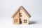 Divorce, division of property, poverty. Wooden broken house on light background. AI Generated