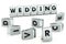 DIVORCE word written on glossy blocks and fallen over blurry blocks with WEDDING letters, isolated on white. Many weddings leads