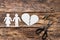 Divorced couple near a broken heart on a wooden background