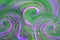 divorces of green and lilac colors due to swirling waves