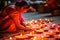 Diwali Festival of Lights: Woman Admiring Burning Oil Lamps in Traditional Indian Dress - Generative AI