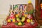 Diwali pooja arrangement with rangoli and prasad offering