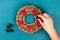 Diy Christmas pasta wreath on blue background. Gift idea, decor Christmas, Xmas, New Year