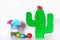 Diy cinco de mayo Mexican Pinata Cactus made cardboard, crepe paper your own hands blue background