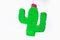 Diy cinco de mayo Mexican Pinata Cactus made cardboard, crepe paper your own hands blue background