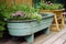 diy garden project with repurposed materials, such as an old wooden bench or metal buckets
