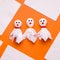 DIY Halloween candy ghost step by step. Image four. Draw ghosts eyes and mouth. Done.