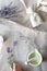 DIY handmade lavender sachets and sugar scrub. Fill in linen bags with dry lavender flowers. Top view on linen tablecloth