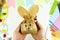 DIY and kids creativity. Step-by-step instructions: how to make an Easter bunny packaging from a craft bag. Step 7 is the finished