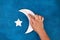 Diy Ramadan kareem crescent moon with a star from a disposable cardboard plate and gold paint