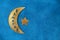 Diy Ramadan kareem crescent moon with a star from a disposable cardboard plate and gold paint