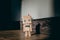diy wooden toy robot stands on a wooden floor