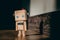 diy wooden toy robot stands on a wooden floor