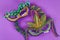 DIY wreath Mardi Gras, Fat Tuesday purple background