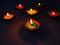 Diyas decorated in diffrent ways to celebrate Festival of lights