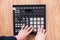 a dj audio producer fingers play the drum music on pads of drum machine