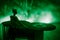 Dj club concept. Woman DJ mixing, and Scratching in a Night Club. Girl silhouette on dj\\\'s deck, strobe lights and fog on