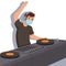 DJ in a face mask is playing music with his hand up, colorful illustration