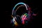 Dj headphones with colorful smoke and paint coming of it in a vivid paint explosion on a black background. Music and sound.