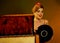 Dj retro woman vintage vinyl turntable music. Girl pin-up style wearing red dress.