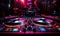 A dj\\\'s turntable in a dark room with neon lights