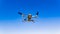 DJI Drone Mavic 2 Pro flying against blue sky