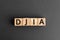 DJIA - acronym from wooden blocks with letters