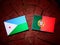 Djibouti flag with Portuguese flag on a tree stump isolated